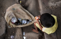 A dalit child collect the floor plastic bottles in the Kolkata streets, near the Howrah Junction railway station.