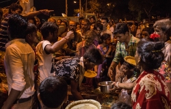 Near the Ganga Crematory slum many dalit in the night receive food by religious care organizations.